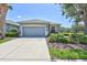 Charming one-story home featuring a two-car garage, well-maintained landscaping, and inviting curb appeal at 4740 105Th E Ave, Parrish, FL 34219