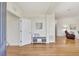 Bright foyer with hardwood floors, a storage bench, and an open view into the living areas at 4740 105Th E Ave, Parrish, FL 34219