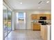 Eat-in kitchen with tile flooring, wood cabinets and backyard views at 4740 105Th E Ave, Parrish, FL 34219