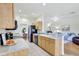 Charming kitchen featuring wood cabinetry, neutral countertops, essential appliances, and tile floors at 4740 105Th E Ave, Parrish, FL 34219