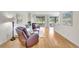Inviting living room with hardwood floors and sliding glass doors to the lanai at 4740 105Th E Ave, Parrish, FL 34219