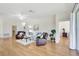 Expansive living room featuring hardwood floors, comfy seating, and natural light at 4740 105Th E Ave, Parrish, FL 34219