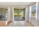 Bright living room features tile floors, neutral walls and expansive sliding glass doors to a screened patio at 4740 105Th E Ave, Parrish, FL 34219