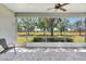 Relaxing screened patio overlooking a serene landscape, creating a seamless indoor-outdoor living experience at 4740 105Th E Ave, Parrish, FL 34219