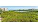 Scenic aerial view showcases lush greenery and waterway views surrounded by low-rise and high-rise buildings at 4801 Osprey S Dr # 405, St Petersburg, FL 33711