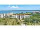 Stunning aerial shot of a waterfront condo complex with lush landscaping and beautiful blue waters at 4801 Osprey S Dr # 405, St Petersburg, FL 33711
