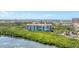 Breathtaking aerial view featuring waterfront scenery of a building complex, waterway, and surrounding neighborhood at 4801 Osprey S Dr # 405, St Petersburg, FL 33711