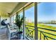 Secluded screened in balcony with seating and water views at 4801 Osprey S Dr # 405, St Petersburg, FL 33711