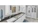 Modern bathroom featuring double sinks, granite countertops, and updated lighting at 4801 Osprey S Dr # 405, St Petersburg, FL 33711