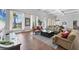 Relaxing clubhouse with comfortable sofas, view of the water and community landscape at 4801 Osprey S Dr # 405, St Petersburg, FL 33711