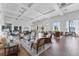 Spacious clubhouse featuring comfortable seating, wood flooring, and large windows offering serene views at 4801 Osprey S Dr # 405, St Petersburg, FL 33711