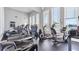 Well-equipped fitness center with modern treadmills, elliptical machines, and large windows with community views at 4801 Osprey S Dr # 405, St Petersburg, FL 33711