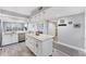 Bright kitchen with center island, stainless steel appliances, and pendant lighting at 4801 Osprey S Dr # 405, St Petersburg, FL 33711