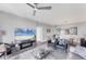 Open-concept living area featuring sleek furnishings, large windows, and access to the dining area and kitchen at 4801 Osprey S Dr # 405, St Petersburg, FL 33711