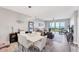 Open floor plan with dining area, living room, and balcony access, offering water views at 4801 Osprey S Dr # 405, St Petersburg, FL 33711