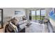 Comfortable living room showcasing contemporary decor and sliding glass doors opening to a balcony with a view at 4801 Osprey S Dr # 405, St Petersburg, FL 33711