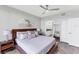Warm main bedroom featuring a serene atmosphere, modern design, and ensuite bathroom at 4801 Osprey S Dr # 405, St Petersburg, FL 33711