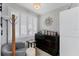 Brightly lit office with a gray chair, white shutters, and wood flooring at 4801 Osprey S Dr # 405, St Petersburg, FL 33711