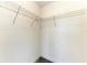 This walk-in closet includes installed wire shelving and neutral-colored carpeting at 5155 78Th St E Cir, Bradenton, FL 34203
