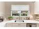 Kitchen sink with garden window providing natural light and views of the outdoors at 5155 78Th St E Cir, Bradenton, FL 34203