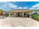A covered community pool pavilion with seating and dining areas at 5155 78Th St E Cir, Bradenton, FL 34203