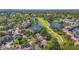 An aerial view of the community showing a lake and a well-maintained golf course at 5291 Willow Links # 54, Sarasota, FL 34235