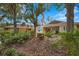 Building exterior with professional signage and attractive landscaping at 5291 Willow Links # 54, Sarasota, FL 34235
