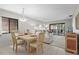 Bright dining area with a tile floor, adjacent to the living room and lanai at 5291 Willow Links # 54, Sarasota, FL 34235