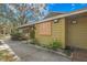 Commercial building exterior with ample natural light, well-maintained landscape, and sidewalk entry at 5291 Willow Links # 54, Sarasota, FL 34235