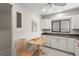 Kitchen nook featuring a drop leaf table and access to kitchen appliances at 5291 Willow Links # 54, Sarasota, FL 34235
