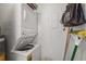 Convenient laundry room with stacked washer and dryer and storage space at 5291 Willow Links # 54, Sarasota, FL 34235