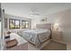 Bright and airy main bedroom features a large window and neutral decor at 5291 Willow Links # 54, Sarasota, FL 34235
