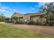 Exterior view of a professional office building with well-kept lawn and shrubbery at 5291 Willow Links # 54, Sarasota, FL 34235