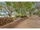 Picturesque park view with benches, beautiful landscaping, and a tranquil lakeside setting at 5291 Willow Links # 54, Sarasota, FL 34235