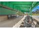 Covered patio with tables and chairs perfect for relaxing or enjoying a meal outdoors at 5291 Willow Links # 54, Sarasota, FL 34235