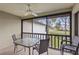 A screened patio has a ceiling fan and offers scenic views of the surrounding landscape at 5291 Willow Links # 54, Sarasota, FL 34235