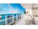 Relaxing balcony with comfortable seating and spectacular waterfront views at 555 Quay Cmn # 1601, Sarasota, FL 34236