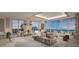 Bright, open living room with large windows and elegant contemporary furnishings at 555 Quay Cmn # 1601, Sarasota, FL 34236