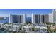 Stunning aerial view of the condo buildings, waterfront, and amenities at 555 Quay Cmn # 804, Sarasota, FL 34236