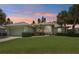 Charming single Gathering home with well-manicured lawn, landscaping and two-car garage at 5596 Sabal Trace Dr, North Port, FL 34287