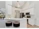 Bright, updated kitchen with white cabinets, stainless steel appliances and breakfast bar at 5596 Sabal Trace Dr, North Port, FL 34287