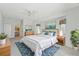Inviting main bedroom with plush carpet, ample natural light, and en-suite bathroom access at 5596 Sabal Trace Dr, North Port, FL 34287