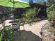 Backyard features tropical foliage, stone pavers and a screened in back porch at 590 Artists Ave, Englewood, FL 34223