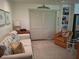 Living room featuring a sofa, chair, and built-in storage, perfect for relaxation at 590 Artists Ave, Englewood, FL 34223