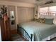 Comfortable bedroom featuring a large bed, closet space, and tasteful decor at 590 Artists Ave, Englewood, FL 34223