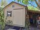 Exterior view of shed showing the door and window unit at 590 Artists Ave, Englewood, FL 34223