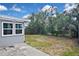 Large backyard with fence and mature shade trees at 5905 Olive Ave, Sarasota, FL 34231