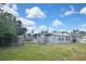 View of a large backyard with fence and shade trees at 5905 Olive Ave, Sarasota, FL 34231