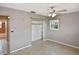 Bedroom featuring a closet, a window, and access to the bathroom at 5905 Olive Ave, Sarasota, FL 34231