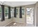 Bonus room features tile floors, natural lighting, and access to the backyard at 5905 Olive Ave, Sarasota, FL 34231